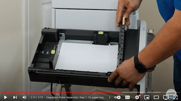 A printer technician removes the paper tray on the Xerox VersaLink B625
