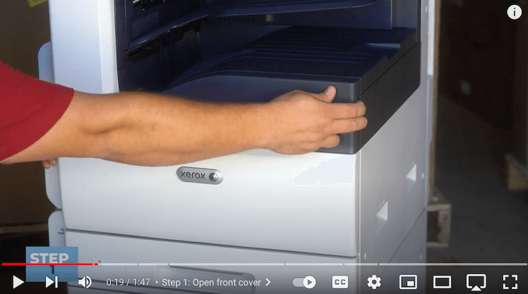 Printer technician opens the front cover of the Xerox VersaLink C7030