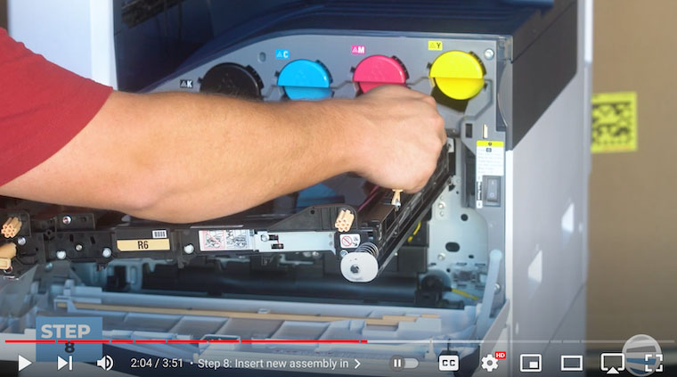Printer technician inserts new assembly on Xerox VersaLink C7020/C7025/C7030
