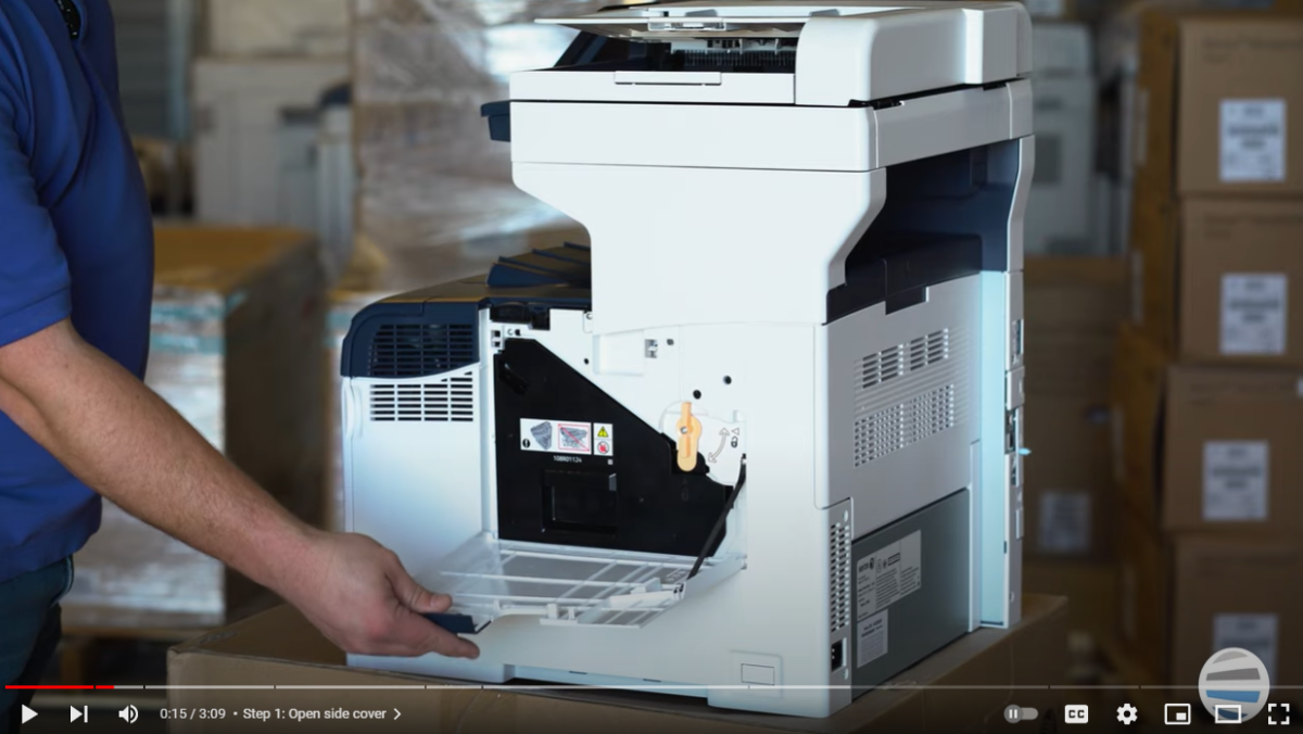 Screen capture of a printer technician opening the side cover for a unit