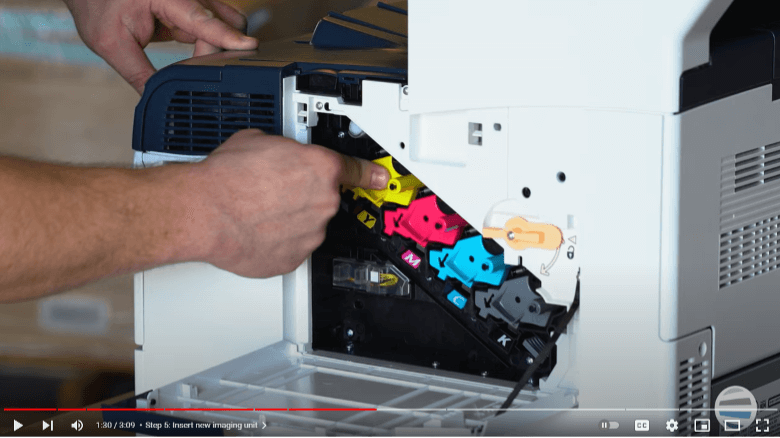 Screenshot of a printer technician inserting the new imaging unit