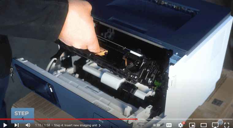 Printer technician inserts the new imaging unit on the Xerox B410/B415