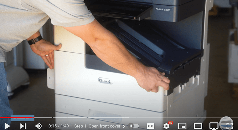 Printer technician opens the front cover on the Xerox AltaLink B8090 Printer