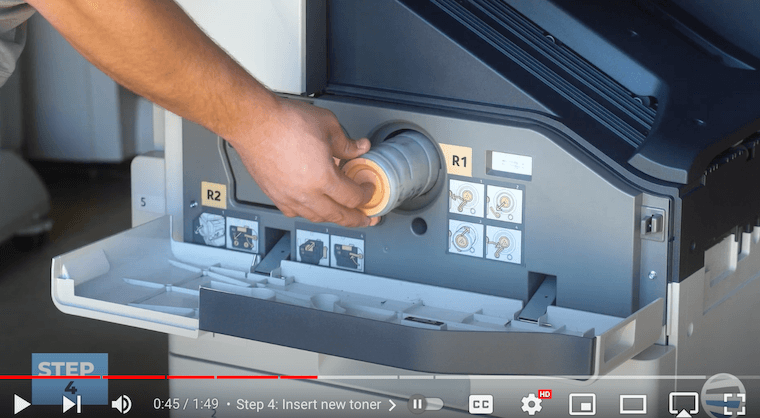 Printer technician inserts new toner on the Xerox AltaLink B8090 Printer